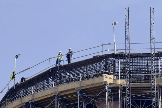 Ladder leading to Walnut Creek Scaffolding Rental platform on building exterior